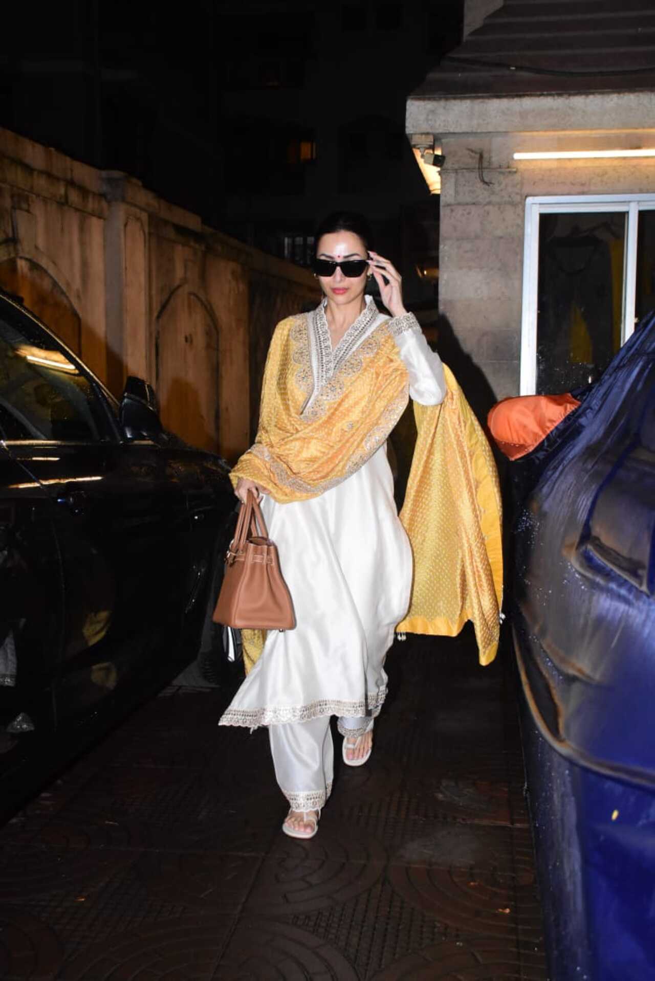 Malaika Arora was clicked outside her mother's residence this evening after celebrating Onam
